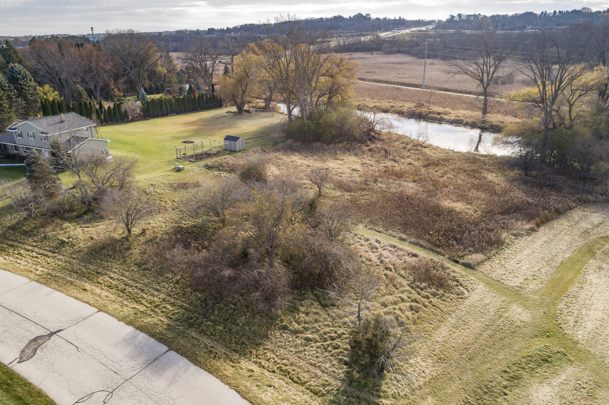 Drone View Fieldhack Dr Lot With Pond - Pewaukee WI