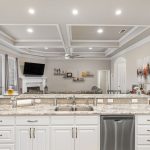 A large island in the kitchen will quickly become the center of activity, bringing together the living room and dining area.