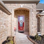 Covered front porch welcomes guests into this beautiful home at 4923 Lantana Drive.