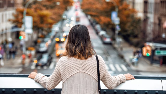 Woman-pondering-fall-real-estate-city-690x394