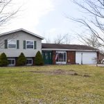 Front of Tri Level Home with attached garage.