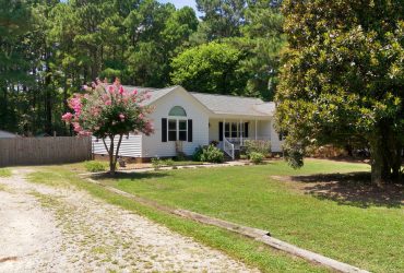 Front-Porch Charm, Modern Updates, and Nearly an Acre to Enjoy