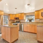 Beautifully redone kitchen with granite counter tops and island in Monterey Park