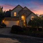 16228 SW Cooper Ln Tigard OR 97224 front exterior at twilight, two-story Meyers Farm home for sale $685,000