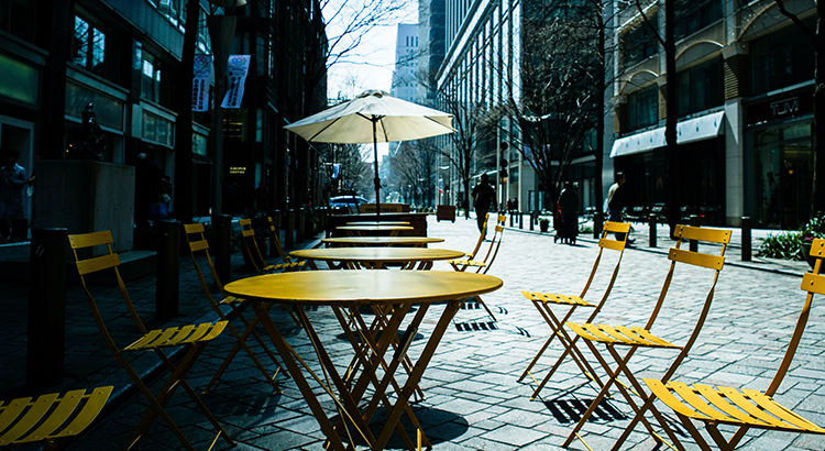 Unemployment: Hope on the Horizon Empty Chairs And Tables At Cafe In City
