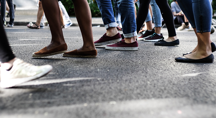 Low Section Of People Walking On Sidewalk